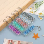 Button press fidget keychains in assorted colors and layouts