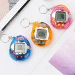Round virtual pet game keychains in colorful stock shells
