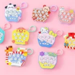 Cartoon whack-a-mole game keychains in assorted designs and colors