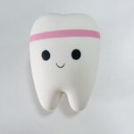White tooth-shaped PU slow-rising stress toy with pink stripe