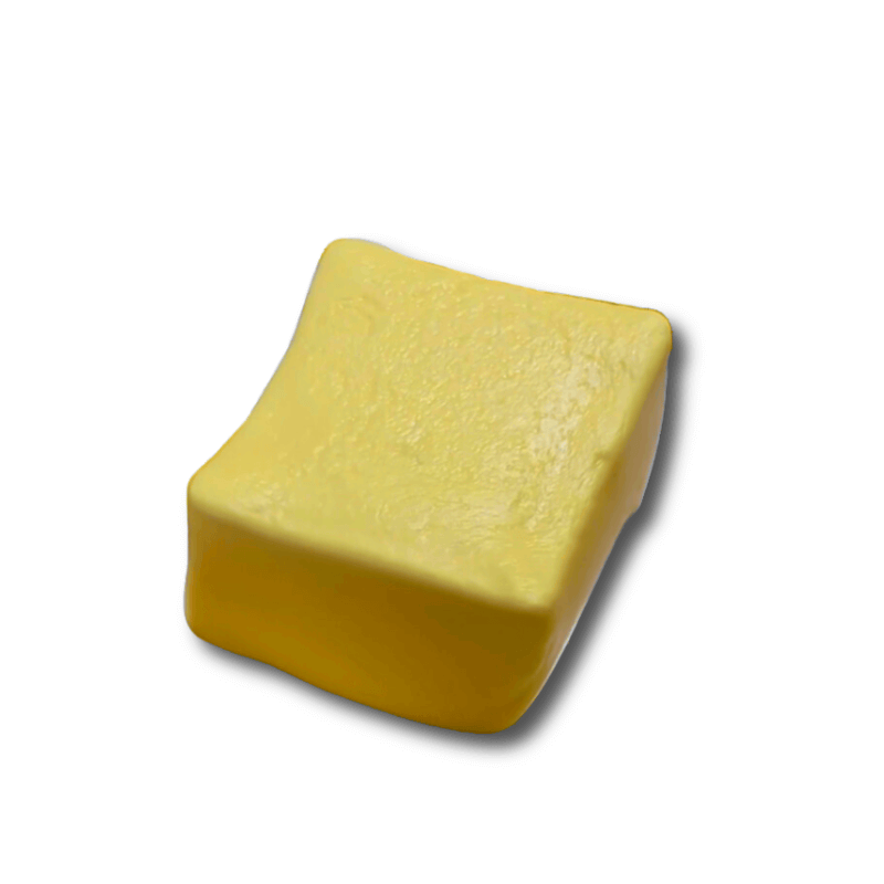 Yellow butter-style crunchy squishy sensory toy on white background