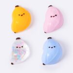 Banana squishy toys in assorted yellow pink clear and blue colors