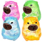 Four glitter color capybara squishy toys on white background