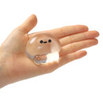 Crystal clear jellyfish squishy toy shown in hand