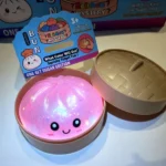 Pink glow dumpling squishy supplier sample in steamer container