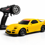 Compact RC racing and drift car with pistol-grip controller on a white background